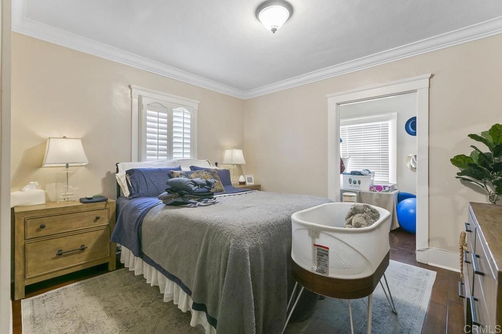 3373-3379 1/2 Herman Avenue San Diego, CA 92104 - Photo 20 of 70 a bed room with a bed a potted plant and a window