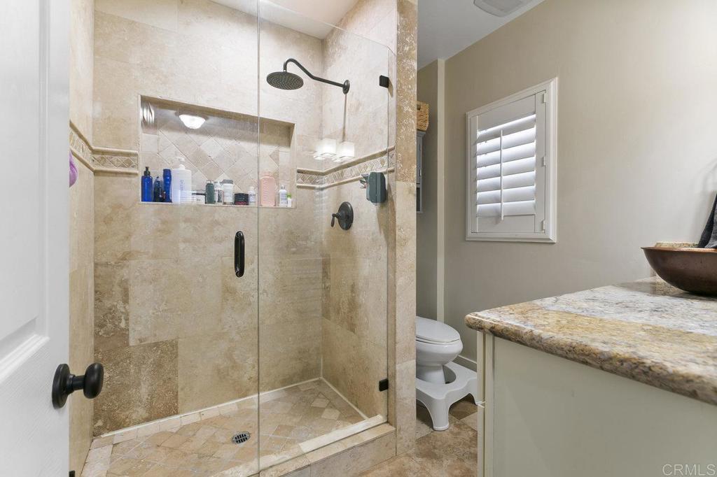 3373-3379 1/2 Herman Avenue San Diego, CA 92104 - Photo 22 of 70 a bathroom with a granite countertop sink a toilet and shower