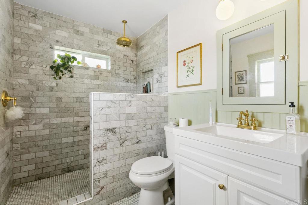 3373-3379 1/2 Herman Avenue San Diego, CA 92104 - Photo 31 of 70 a bathroom with a sink toilet and shower