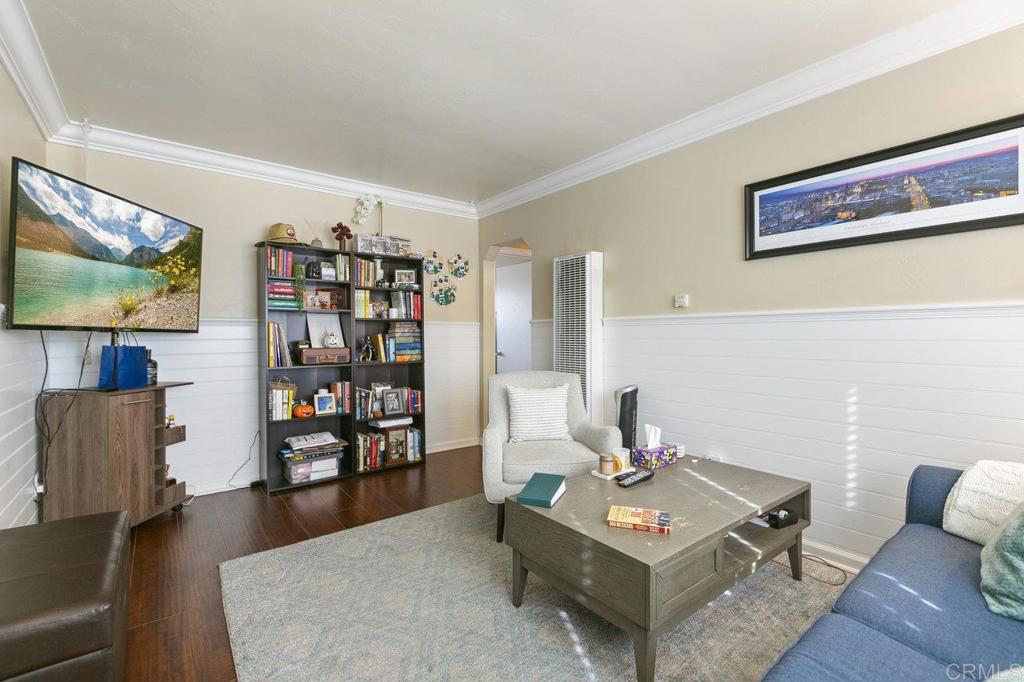 3373-3379 1/2 Herman Avenue San Diego, CA 92104 - Photo 32 of 70 a living room with furniture and a flat screen tv