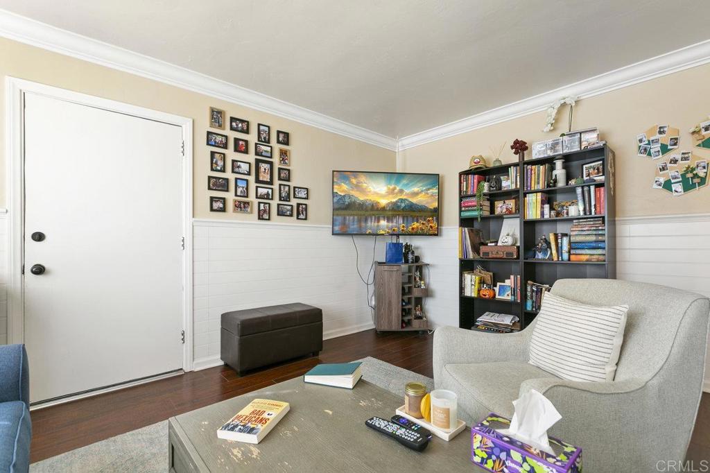 3373-3379 1/2 Herman Avenue San Diego, CA 92104 - Photo 33 of 70 a living room with furniture and a bookshelf