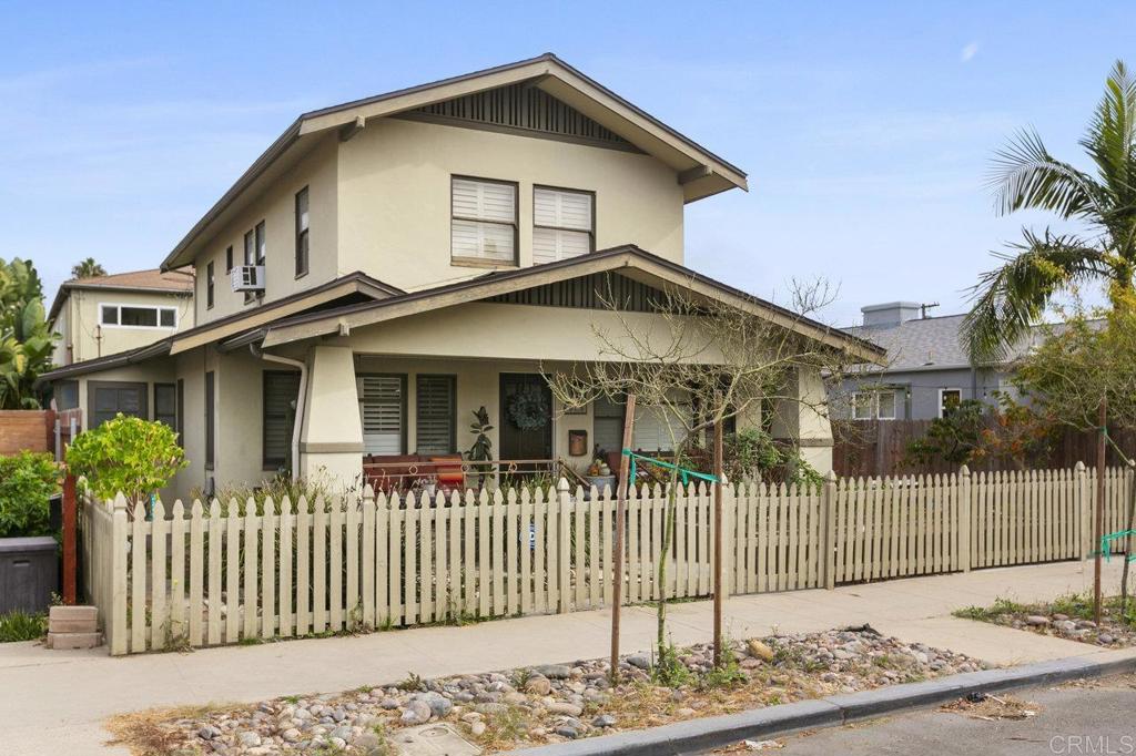 3373-3379 1/2 Herman Avenue San Diego, CA 92104 - Photo 4 of 70 a front view of a house with a garden