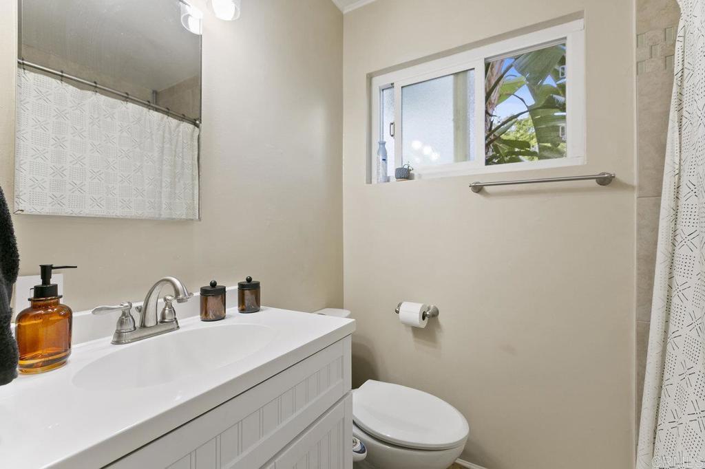 3373-3379 1/2 Herman Avenue San Diego, CA 92104 - Photo 48 of 70 a bathroom with a sink a toilet and a window