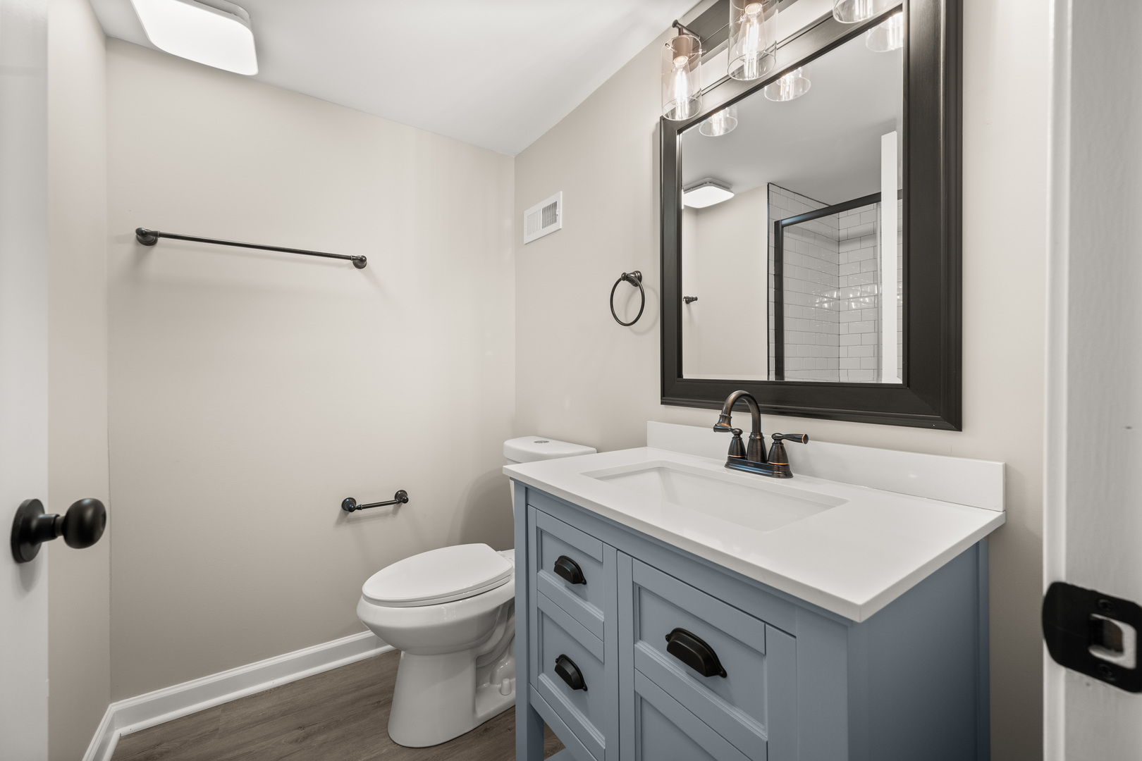 321 North Locust Street Sycamore, IL 60178 - Photo 20 of 38 a bathroom with a sink and a mirror