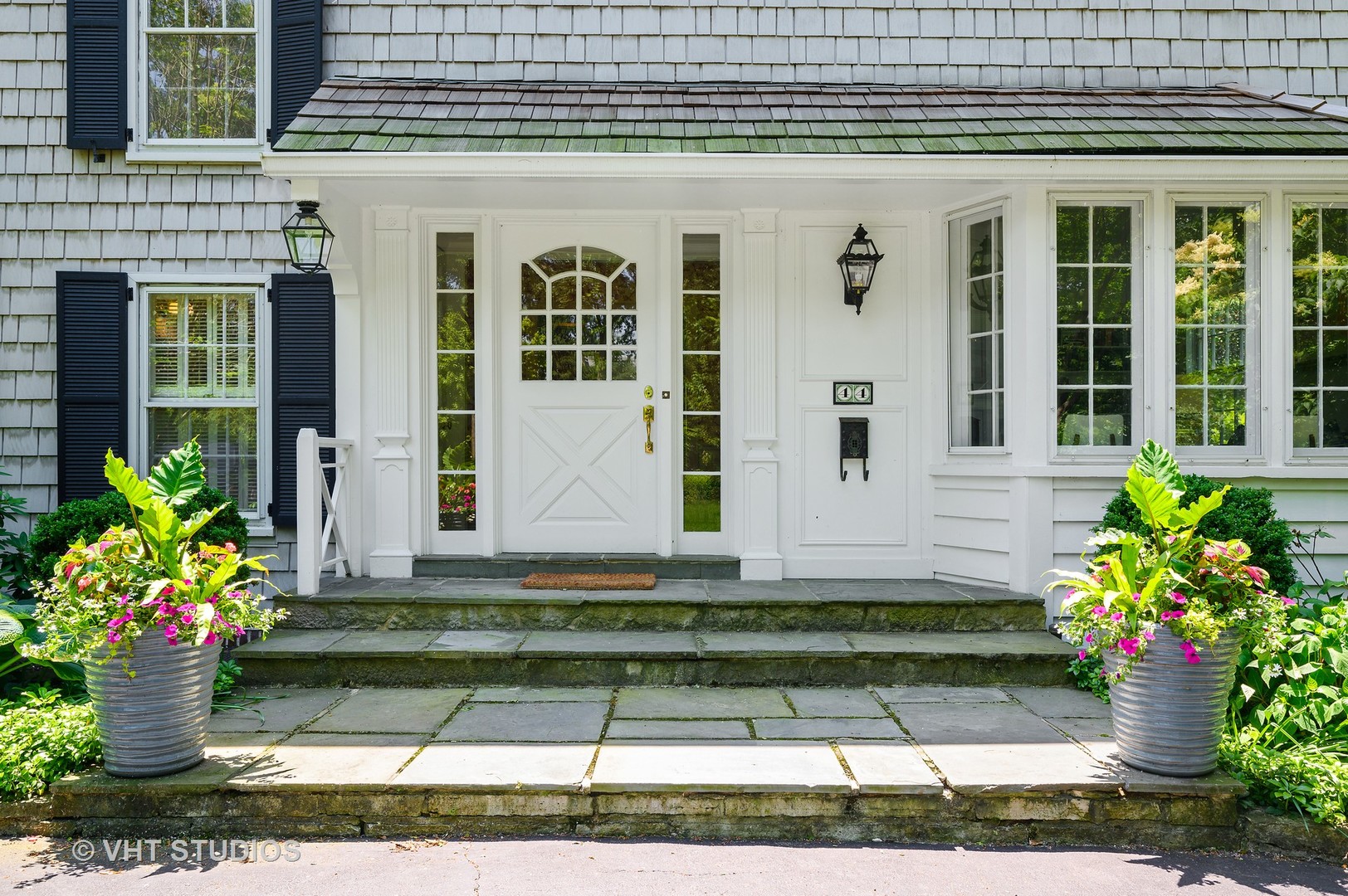 44 Indian Hill Road Winnetka, IL 60093 - Photo 2 of 49 a front view of a house with a yard
