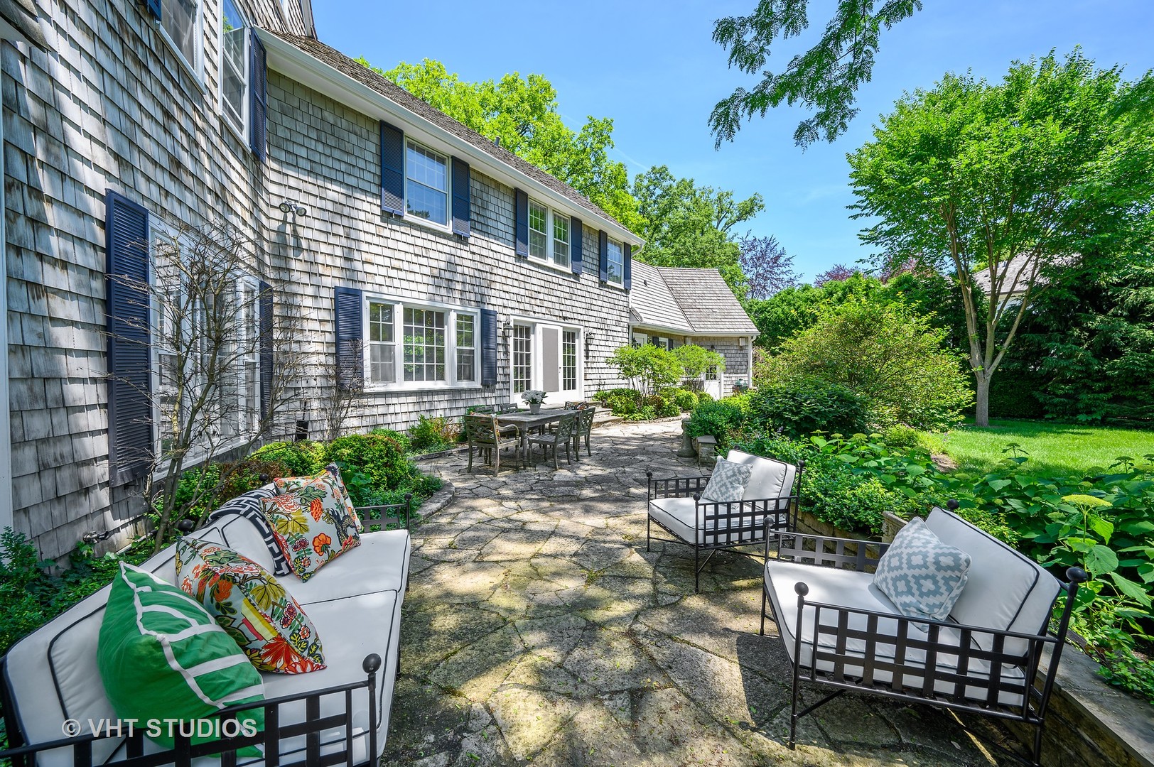 44 Indian Hill Road Winnetka, IL 60093 - Photo 18 of 49 a view of a patio with couches table and chairs and potted plants