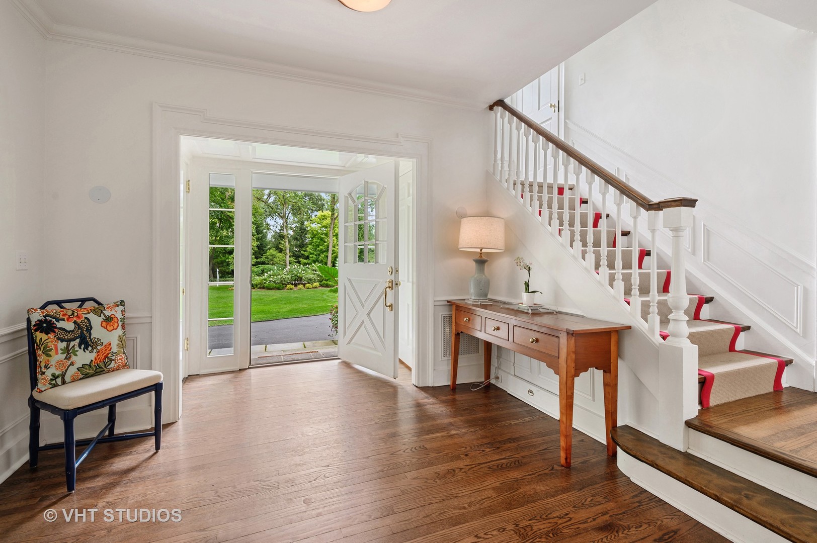 44 Indian Hill Road Winnetka, IL 60093 - Photo 3 of 49 a living room with furniture and a wooden floor next to a window