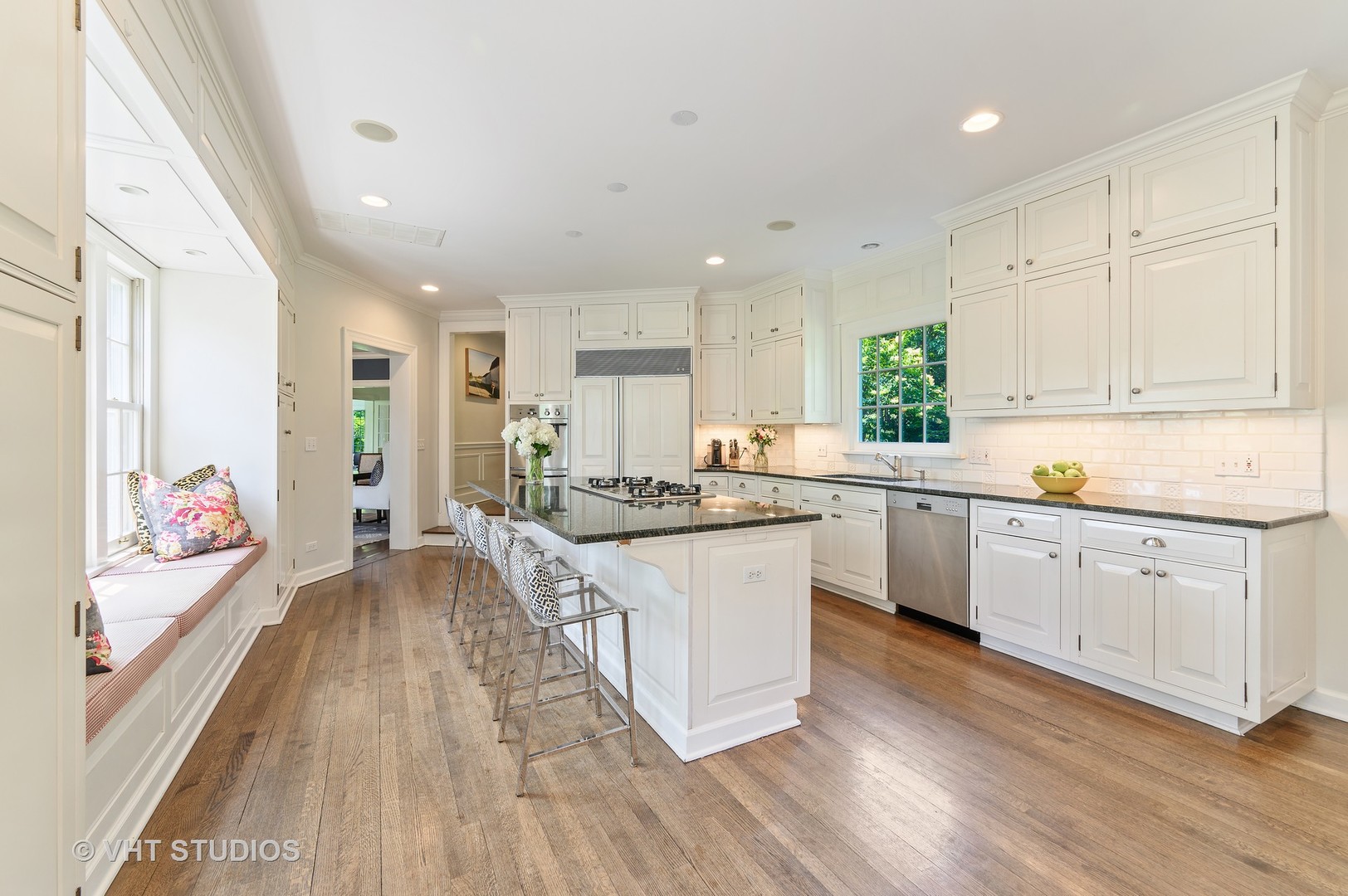 44 Indian Hill Road Winnetka, IL 60093 - Photo 26 of 49 a large kitchen with stainless steel appliances granite countertop a lot of counter space and wooden floors