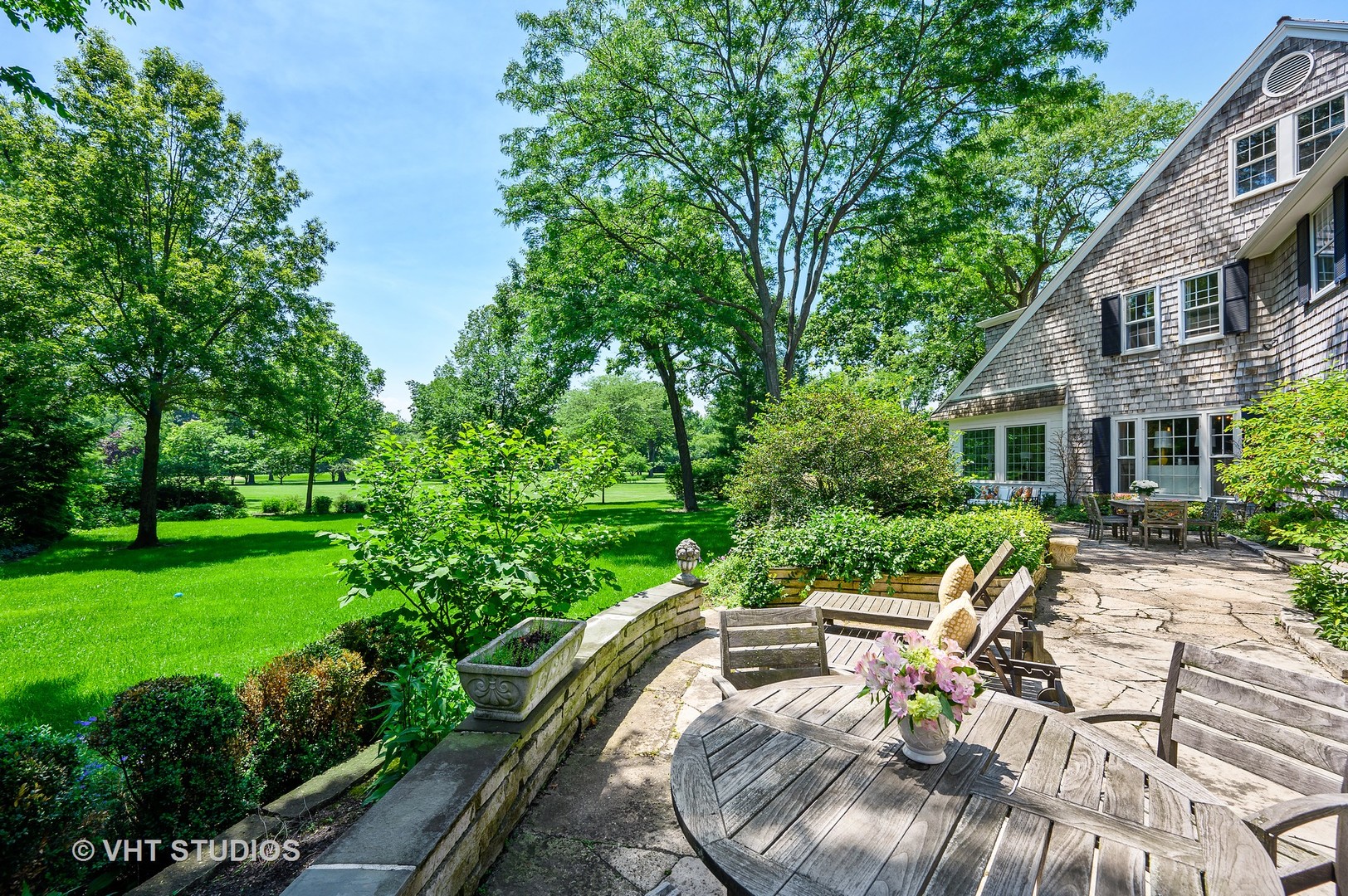 44 Indian Hill Road Winnetka, IL 60093 - Photo 31 of 49 a view of backyard with swimming pool and outdoor seating