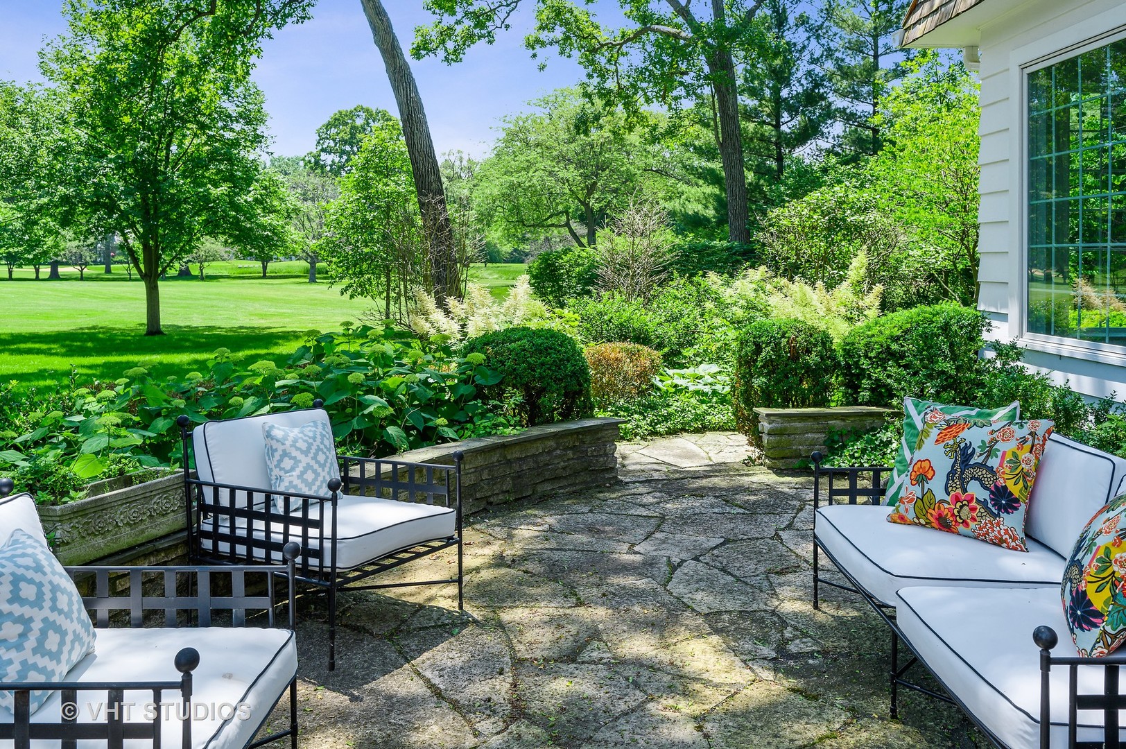 44 Indian Hill Road Winnetka, IL 60093 - Photo 32 of 49 a view of a chairs and table in backyard