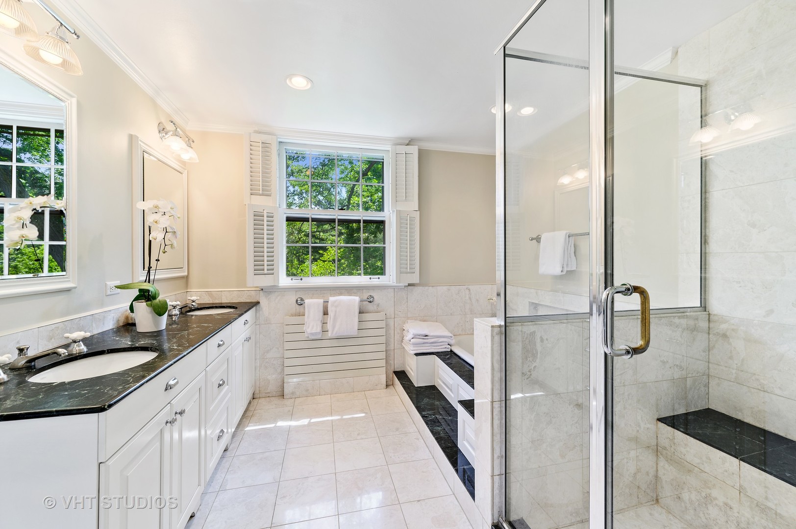 44 Indian Hill Road Winnetka, IL 60093 - Photo 37 of 49 a bathroom with a granite countertop sink mirror and a shower