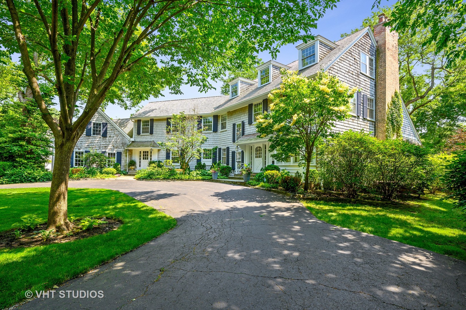 44 Indian Hill Road Winnetka, IL 60093 - Photo 48 of 49 a view of a big yard next to a house