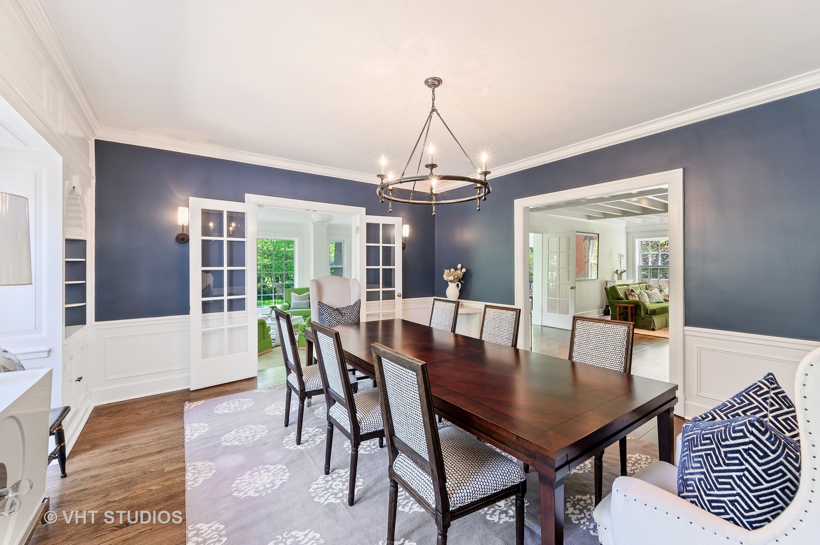 44 Indian Hill Road Winnetka, IL 60093 - Photo 10 of 49 a dining room with furniture wooden floor a rug and a chandelier