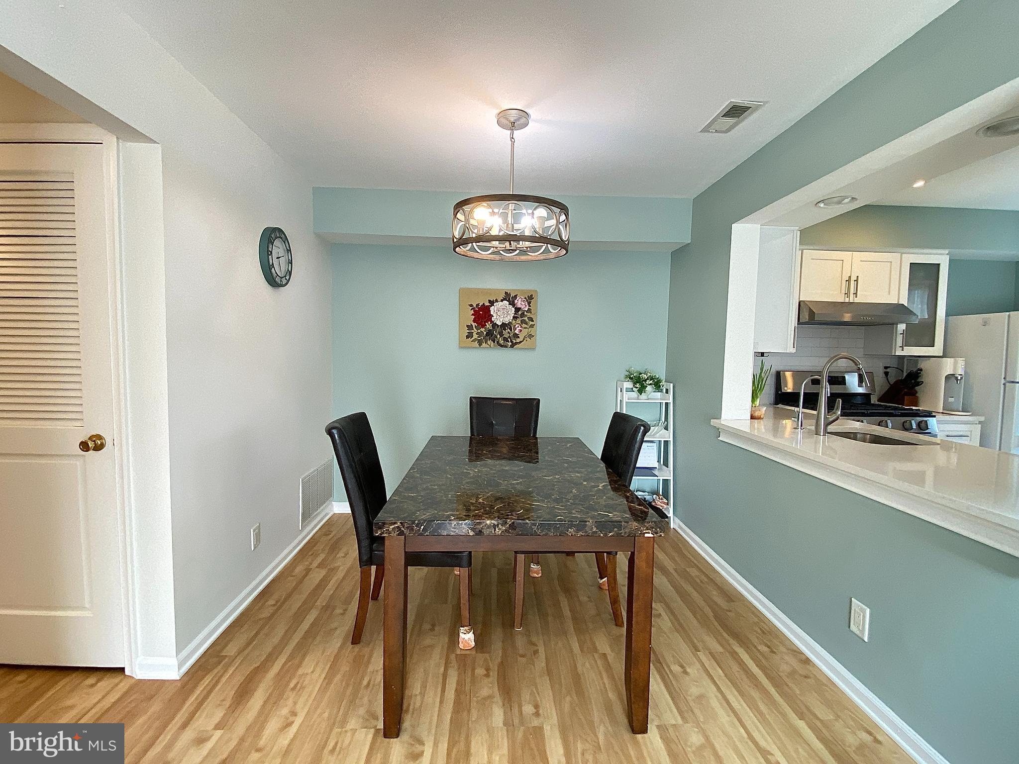 508 Trescott Place Mount Laurel, NJ 08054 - Photo 2 of 12 a view of a dining room with furniture wooden floor and a window