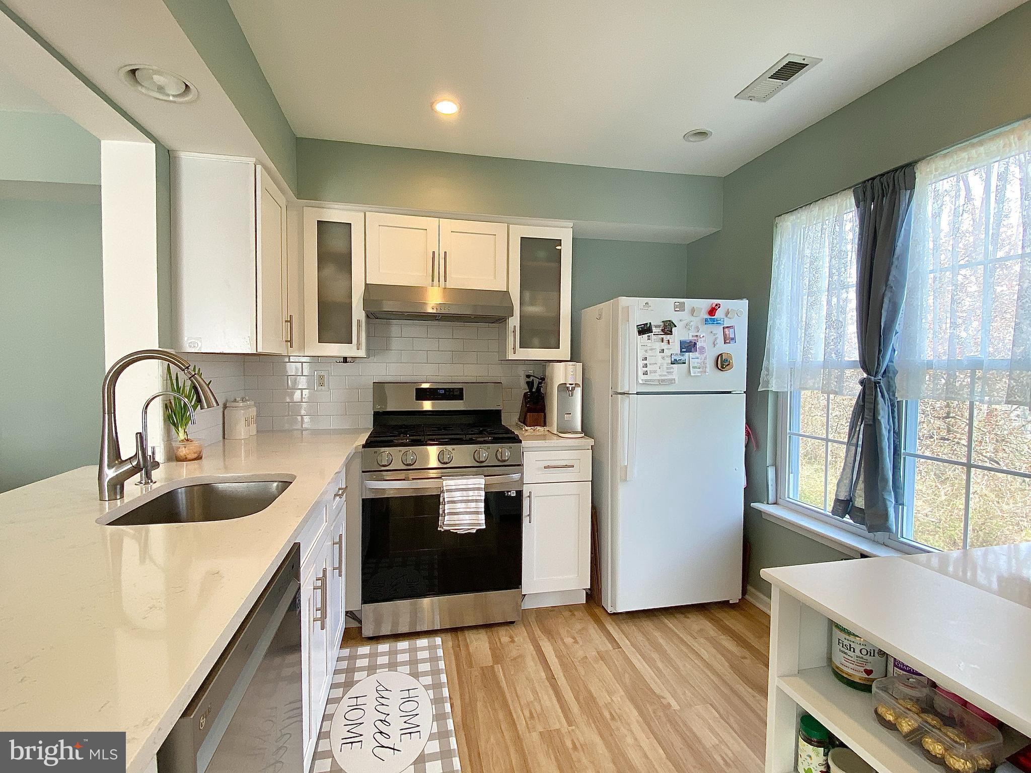 508 Trescott Place Mount Laurel, NJ 08054 - Photo 3 of 12 a kitchen with a white cabinets and white appliances
