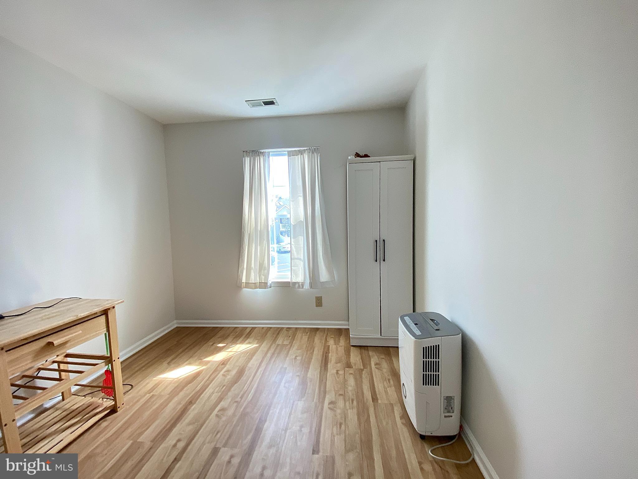 508 Trescott Place Mount Laurel, NJ 08054 - Photo 9 of 12 an empty room with wooden floor and windows