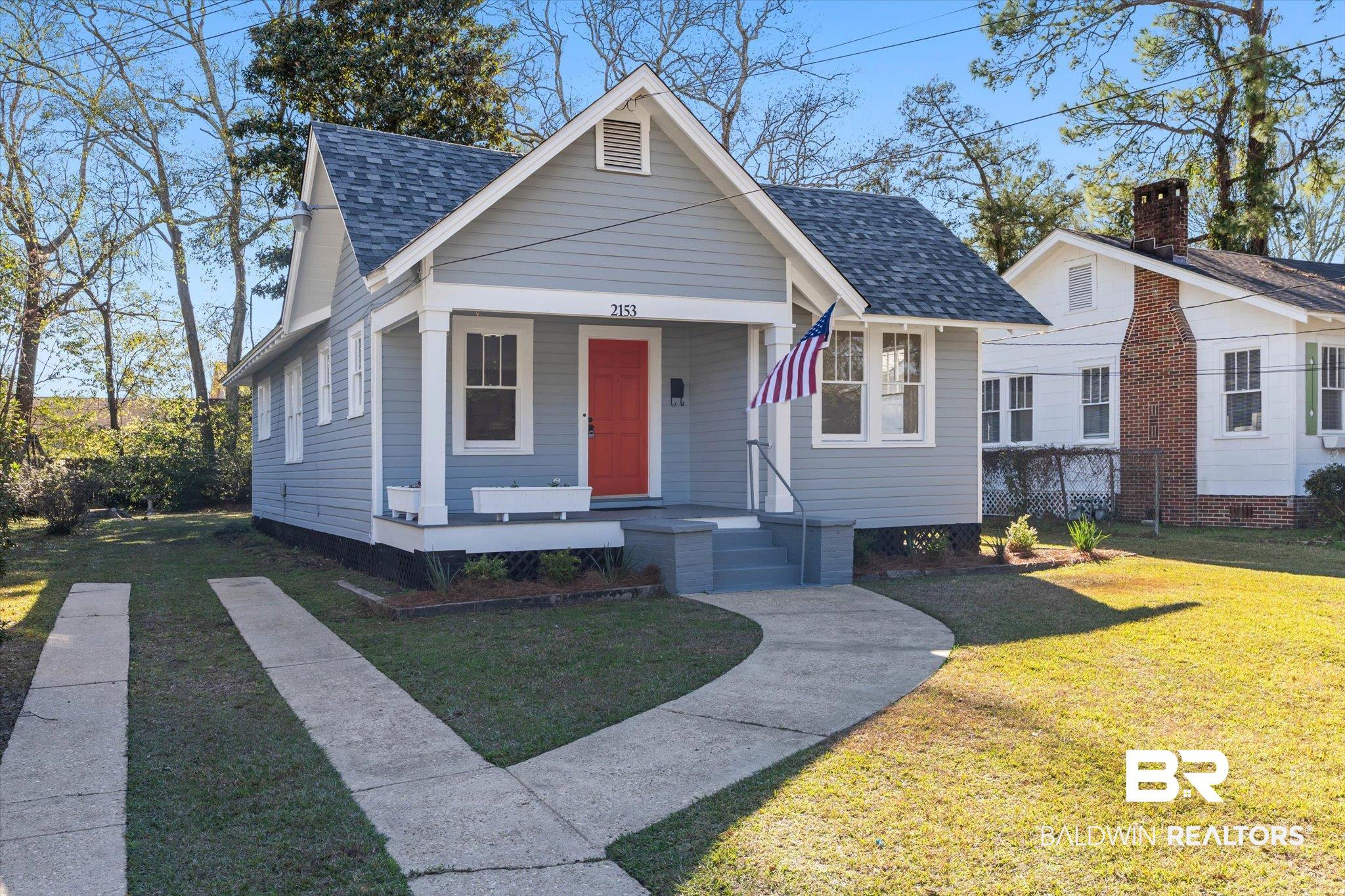 2153 Old Government Street Mobile, AL 36606 - Photo 1 of 23 Bungalow-style house featuring a front yard, a porch, and a shingled roof