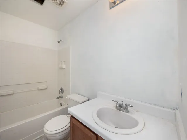 a bathroom with a toilet a sink and a bathtub