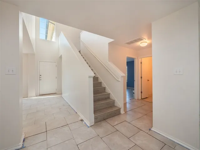 a view of entryway and hall with a window