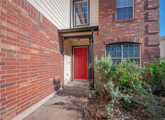 a stone house with a small yard