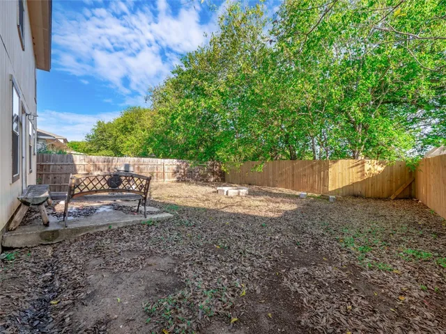 a backyard of a house with lots of green space