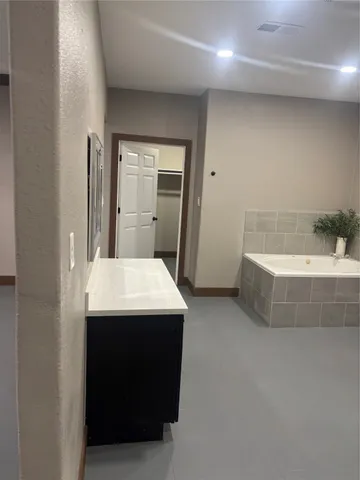 a bathroom with a sink and a bathtub