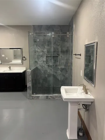 a bathroom with a sink and a mirror