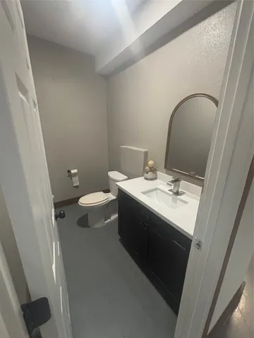 a bathroom with a sink and mirror