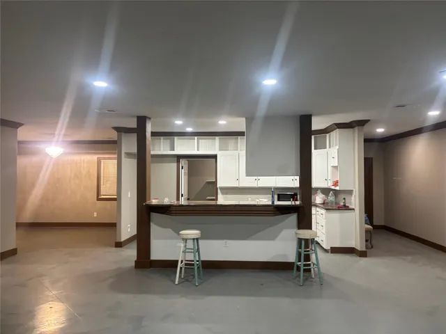 a room with lots of furniture and windows