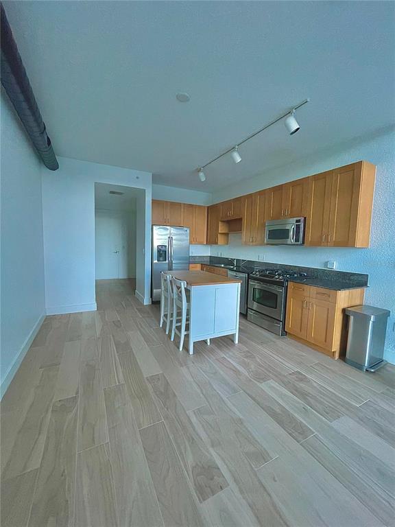 150 East Robinson Street, Unit 2A6 Orlando, FL 32801 - Photo 12 of 33 a view of kitchen with wooden floor