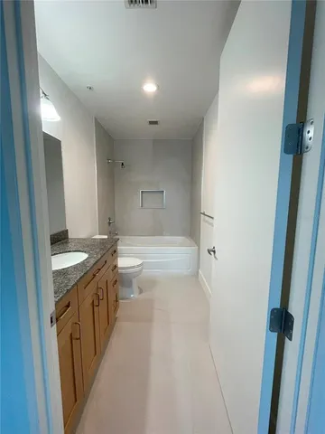 a view of a swimming pool with a potted plants