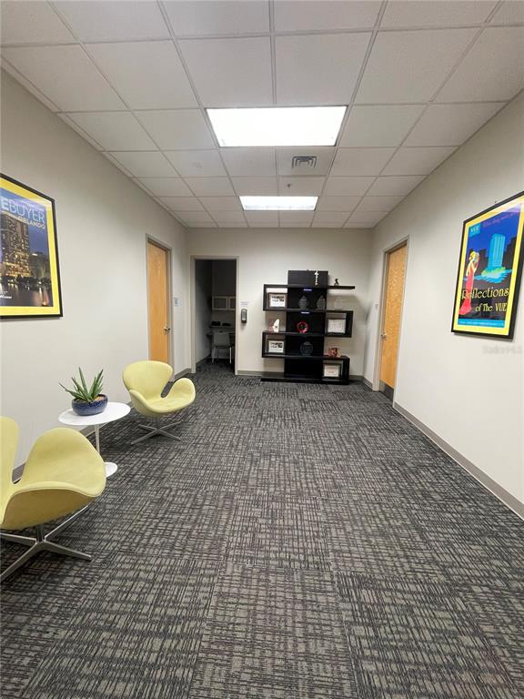150 East Robinson Street, Unit 2A6 Orlando, FL 32801 - Photo 24 of 33 a living room with furniture and a flat screen tv