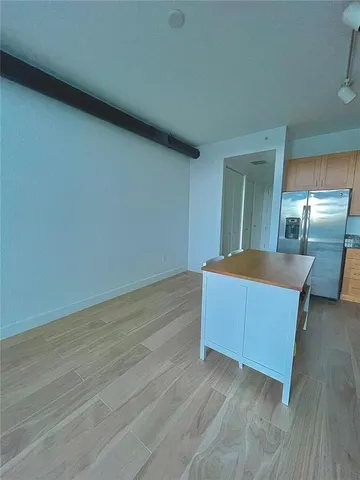 a view of kitchen with wooden floor