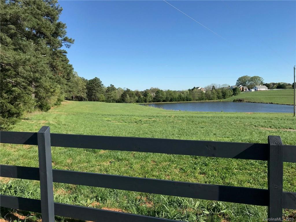 12.40 Doggett Road Forest City, NC 28043 - Photo 13 of 16 a view of a green yard and a lake