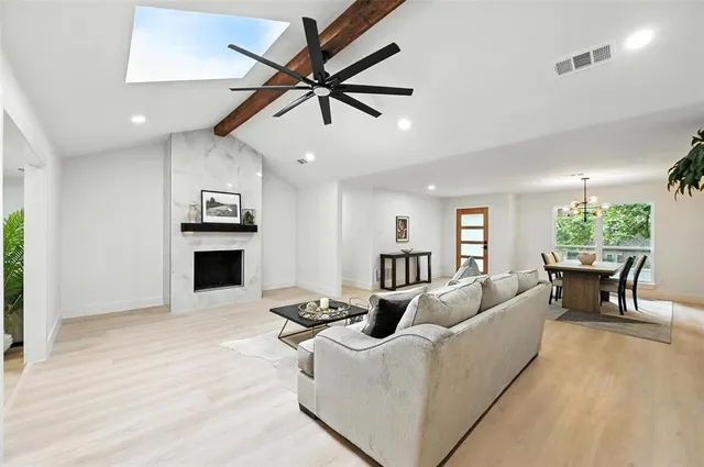 a kitchen with stainless steel appliances kitchen island granite countertop a sink and cabinets
