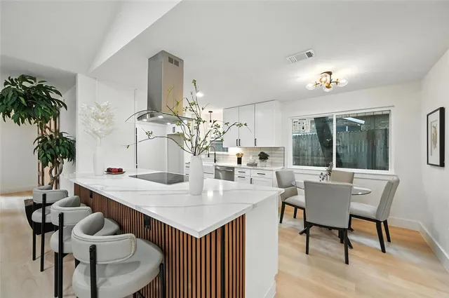 a spacious bathroom with a double vanity sink and mirror
