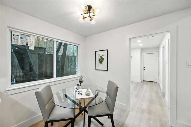 a large bathroom with a double vanity sink toilet mirror and bathtub