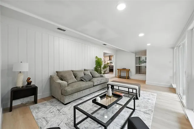 a white bath tub sitting next to a white sink