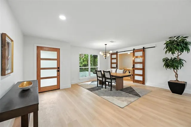 a view of a livingroom with furniture and window
