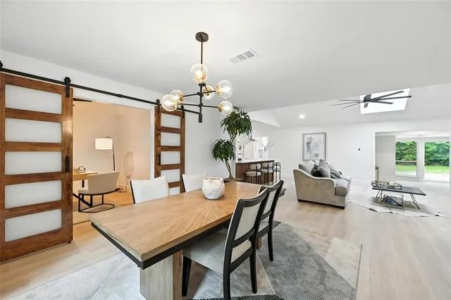 a view of a workspace room with furniture and wooden floor