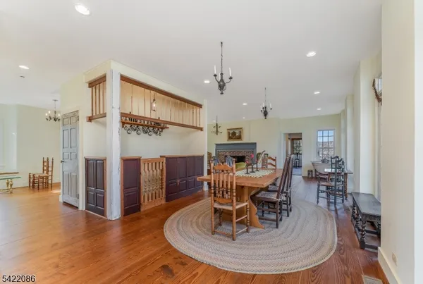 a living room with furniture and a dining table