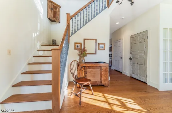a large kitchen with a table and chairs in it