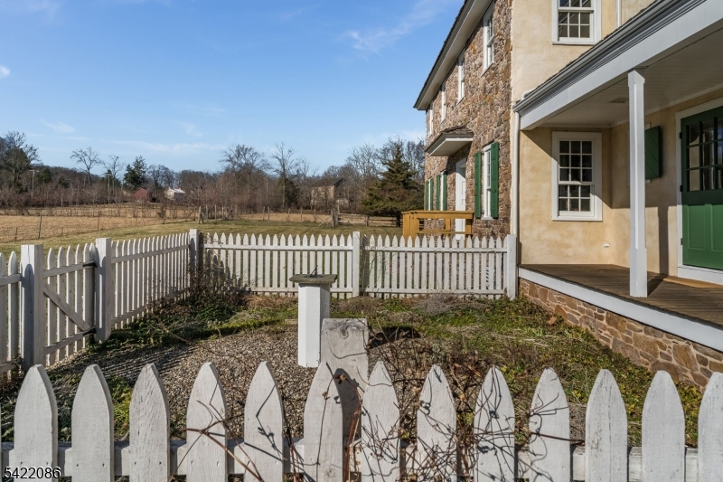 348 Rosemont Ringoes Road Stockton, NJ 08559 - Photo 40 of 49 a view of a house with a wooden fence