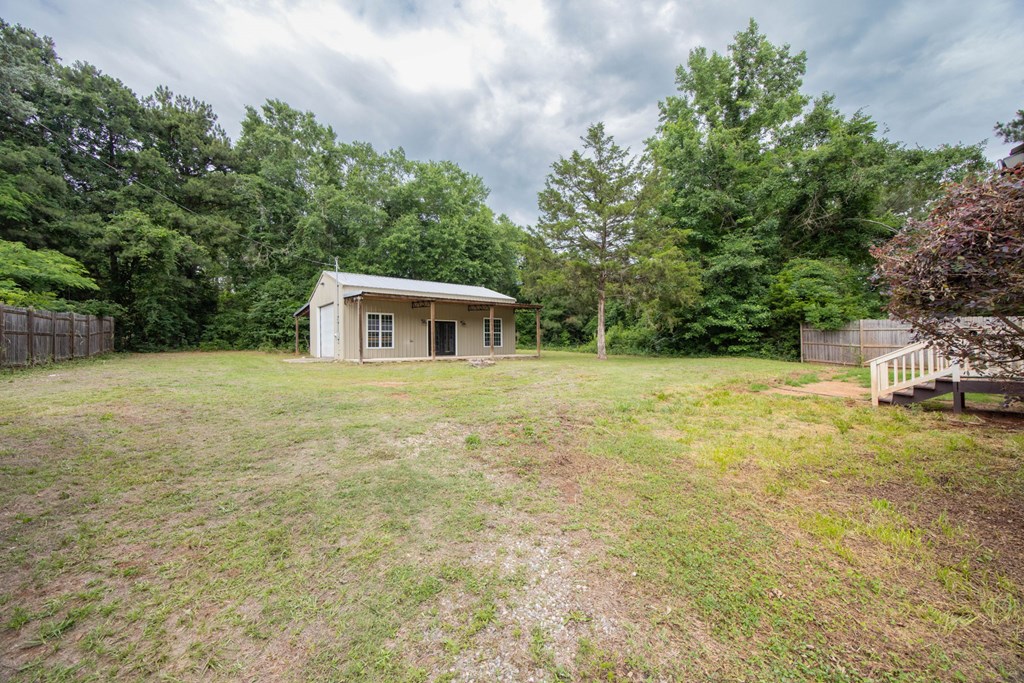 246 Sunnyside Church Road Pine Mountain, GA 31822 - Photo 19 of 26 a backyard of a house with table and chairs