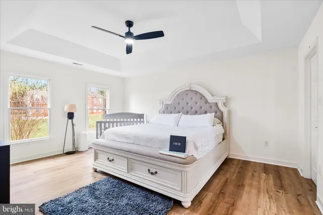 a living room with bed and a window