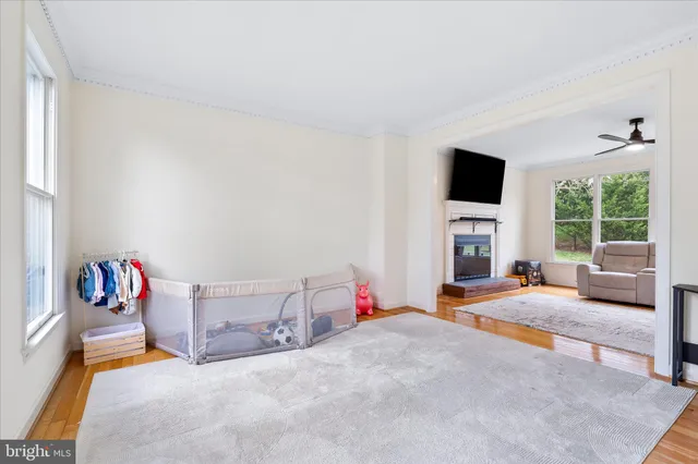 a bedroom with furniture and a flat screen tv