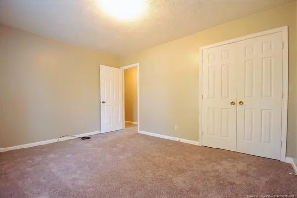 an empty room with a fireplace