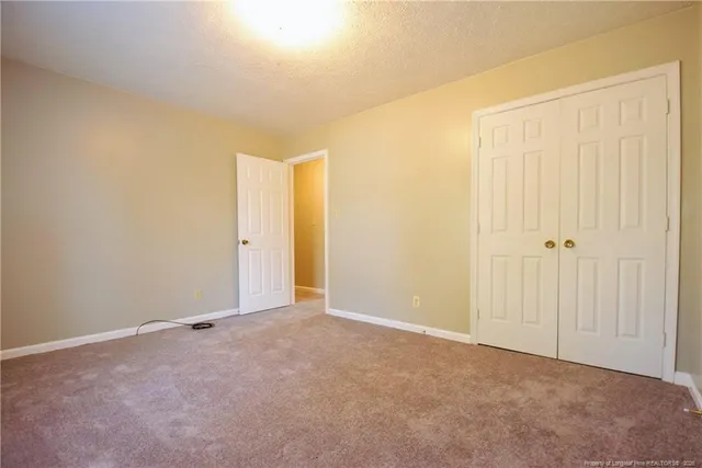 an empty room with a fireplace