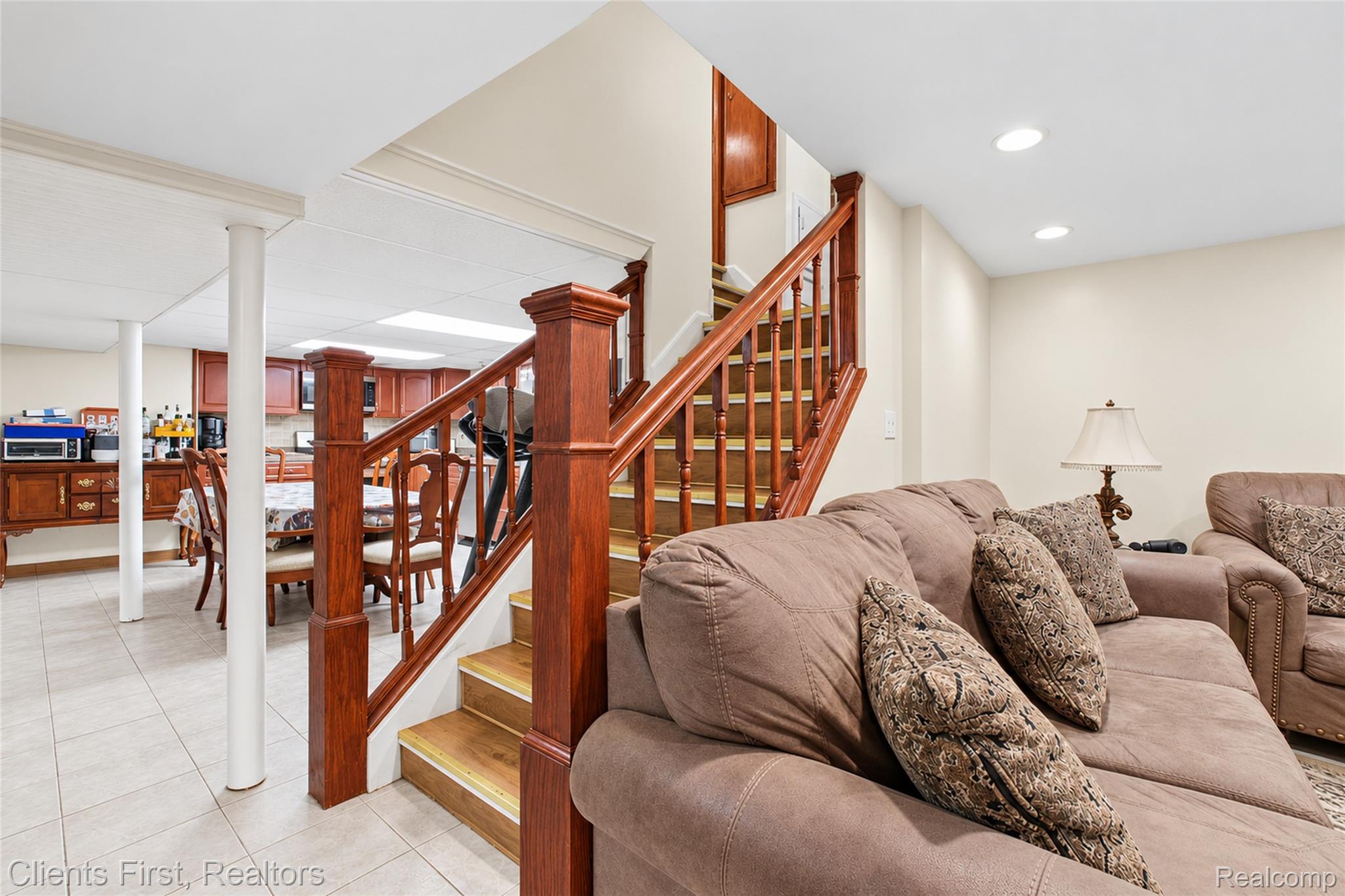 5430 Chase Road Dearborn, MI 48126 - Photo 16 of 34 Hardwood staircase with traditional balusters, recessed ceiling lighting, and light-toned wall finishes
