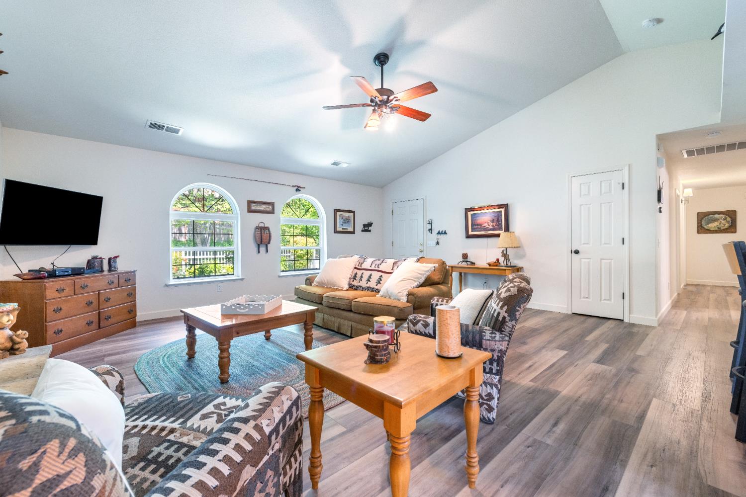 39398 Robin Bass Lake, CA 93604 - Photo 7 of 31 a living room with furniture a flat screen tv and a large window